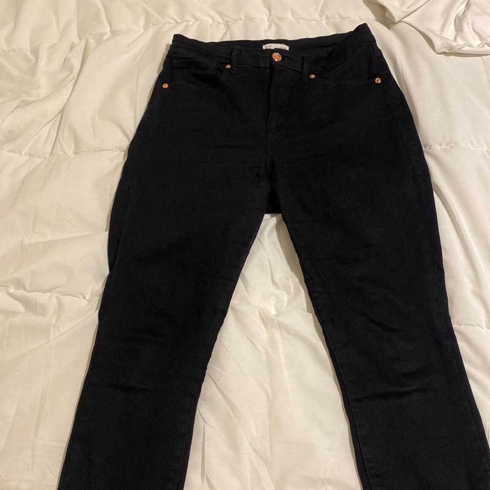 Good American black skinny jeans with tiny slit